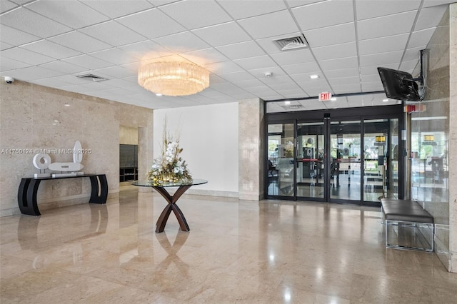 300 Bayview Dr Unit 807, Sunny Isles Beach, FL 33160 - building lobby featuring a drop ceiling