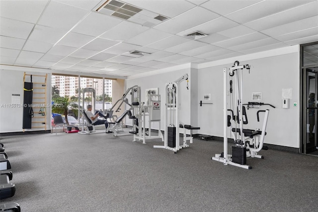 300 Bayview Dr Unit 807, Sunny Isles Beach, FL 33160 - exercise room featuring a drop ceiling and a wall of windows