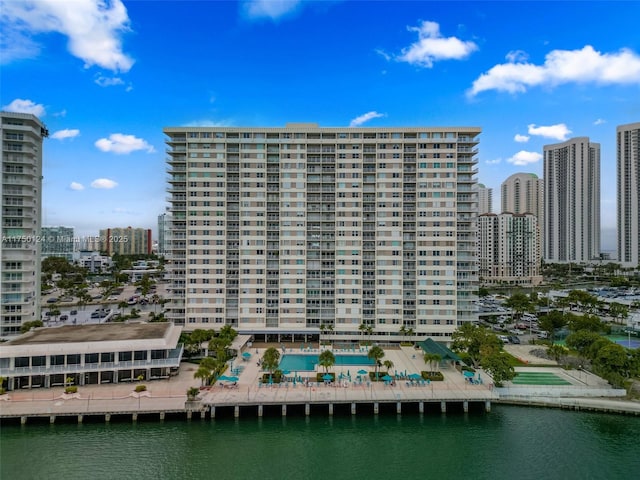 view of property with a view of city and a water view