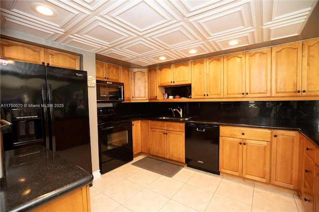 kitchen featuring an ornate ceiling, brown cabinets, black appliances, a sink, and recessed lighting