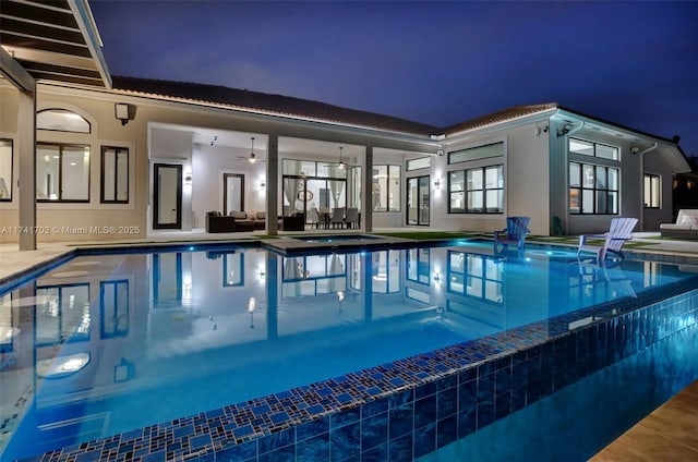 14955 SW 33rd St, Davie, FL 33331 - pool at twilight with outdoor lounge area, ceiling fan, a patio, and a pool with connected hot tub