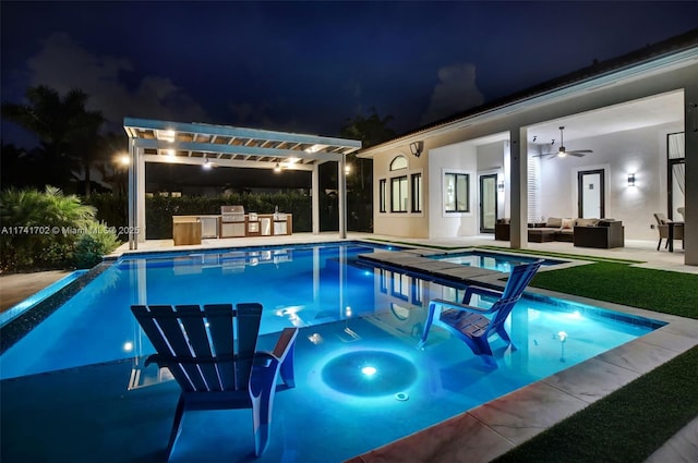 14955 SW 33rd St, Davie, FL 33331 - pool at twilight featuring an outdoor pool, exterior kitchen, outdoor lounge area, and an outdoor hot tub