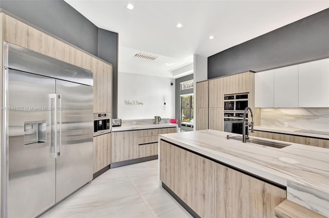 14955 SW 33rd St, Davie, FL 33331 - kitchen with stainless steel built in refrigerator, light brown cabinets, modern cabinets, and recessed lighting