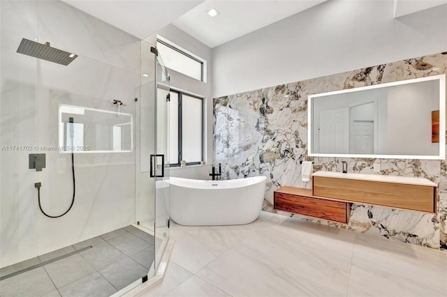 14955 SW 33rd St, Davie, FL 33331 - full bathroom featuring a stall shower, vanity, a freestanding tub, and tile walls
