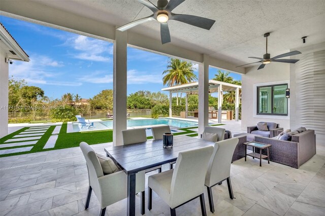 14955 SW 33rd St, Davie, FL 33331 - fenced backyard featuring a ceiling fan, a patio, outdoor lounge area, and an outdoor pool