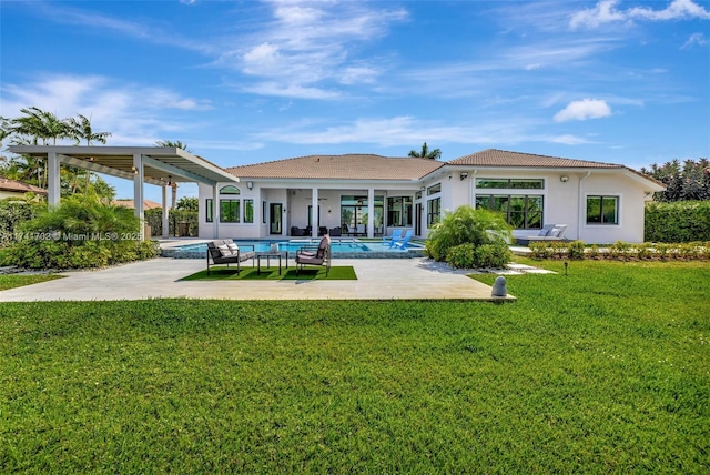 14955 SW 33rd St, Davie, FL 33331 - rear view of house featuring a patio area, an outdoor pool, stucco siding, and a lawn