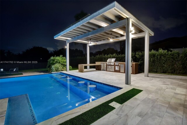 14955 SW 33rd St, Davie, FL 33331 - pool at twilight with exterior kitchen and a patio area