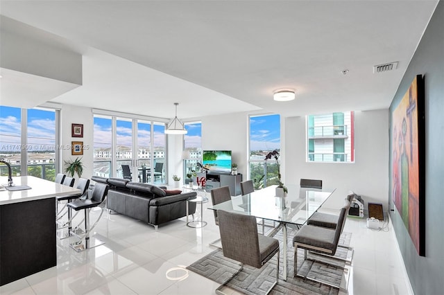 7825 NW 107th Ave Unit 604, Doral, FL 33178 - dining space featuring light tile patterned floors and floor to ceiling windows