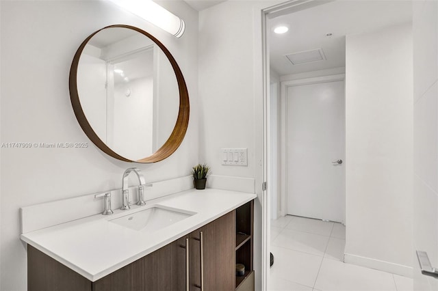 bathroom with tile patterned floors, recessed lighting, and vanity