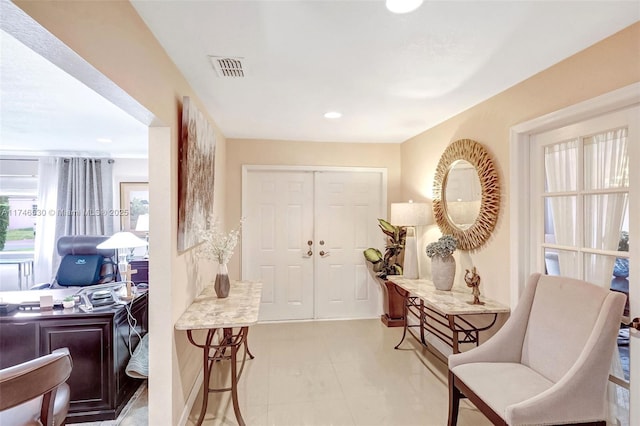 entryway with recessed lighting, visible vents, and light tile patterned floors