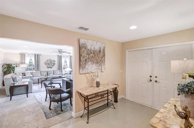 foyer featuring baseboards, visible vents, and recessed lighting