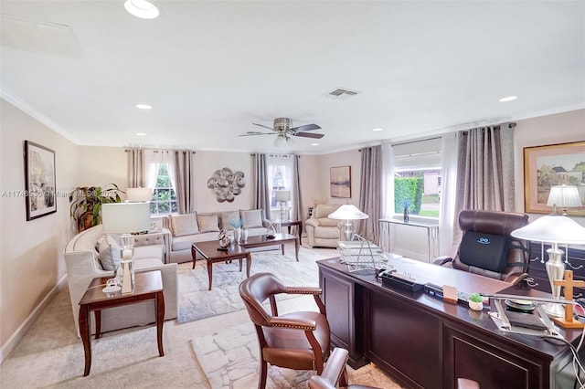 office space with baseboards, a wealth of natural light, visible vents, and crown molding