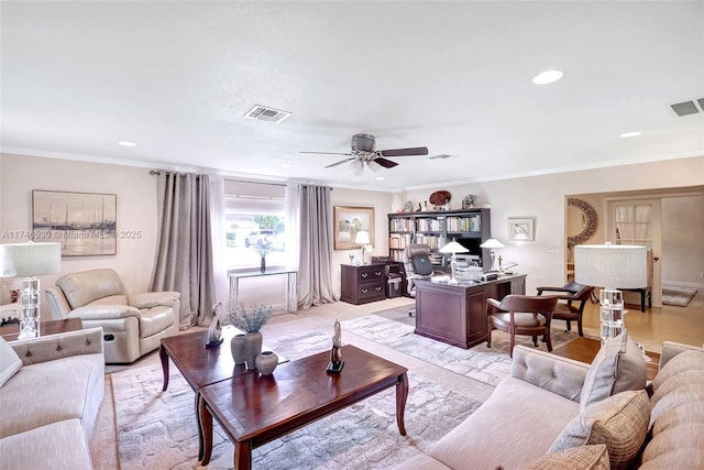 living area featuring ceiling fan, ornamental molding, visible vents, and recessed lighting