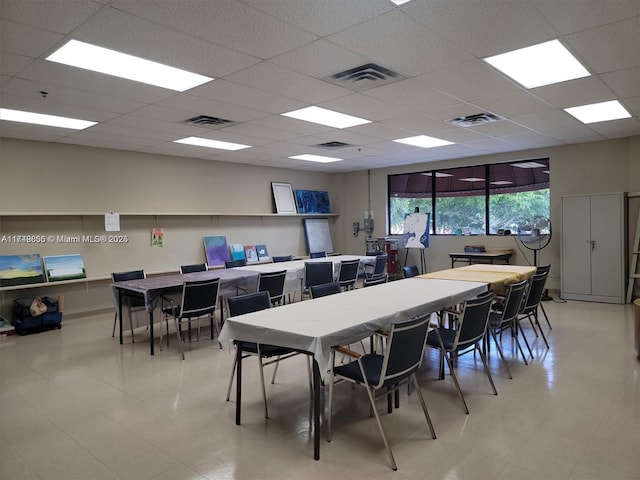 dining space featuring a paneled ceiling and visible vents