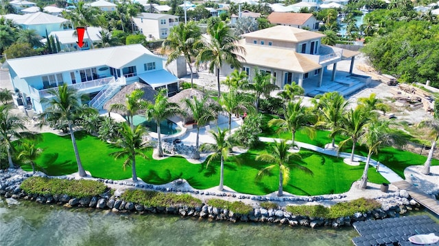 bird's eye view featuring a residential view and a water view