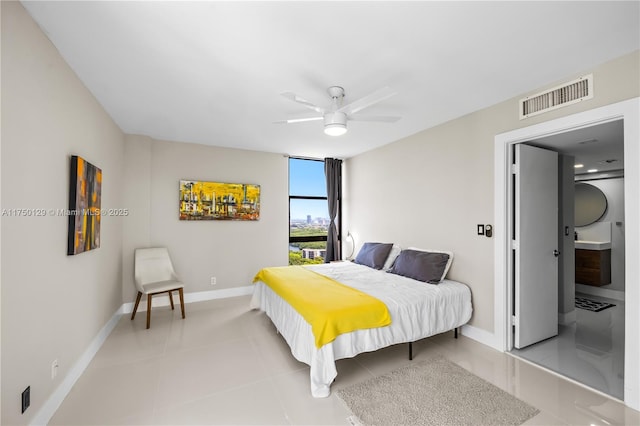 bedroom featuring light tile patterned floors, ceiling fan, visible vents, and baseboards