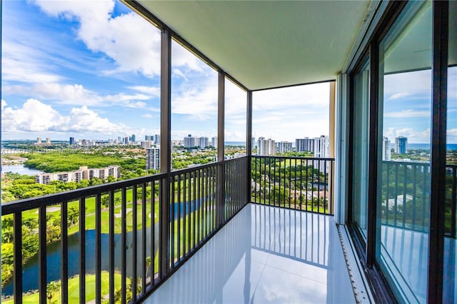 balcony with a water view and a city view