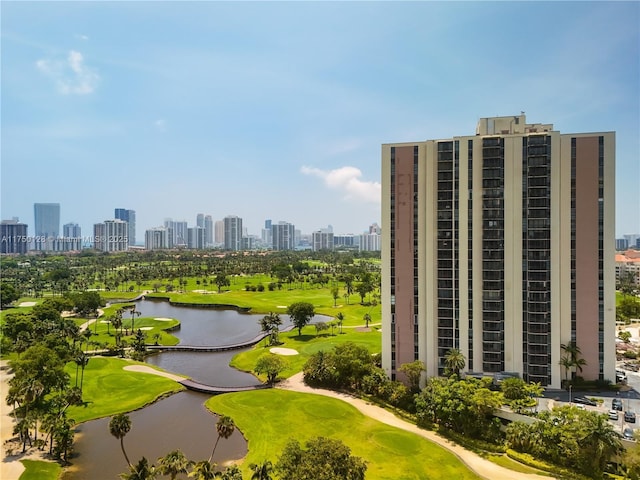 view of property's community with golf course view, a water view, and a city view