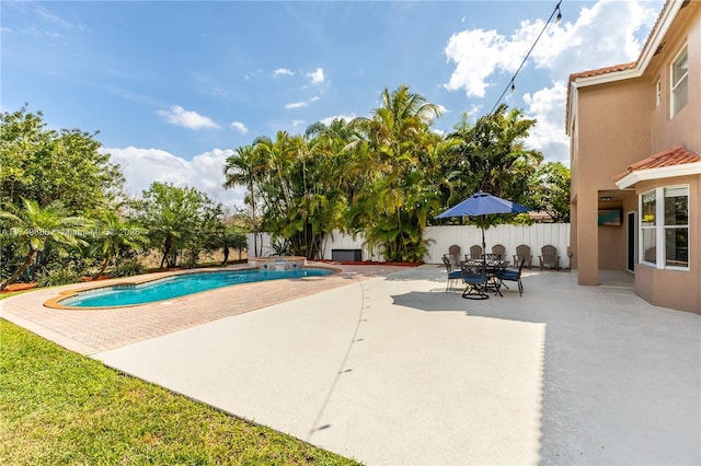 view of swimming pool featuring a patio, a fenced backyard, and a fenced in pool