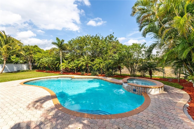 view of pool featuring a pool with connected hot tub and fence