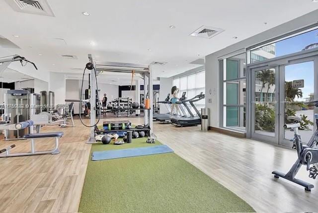 gym featuring visible vents and wood finished floors