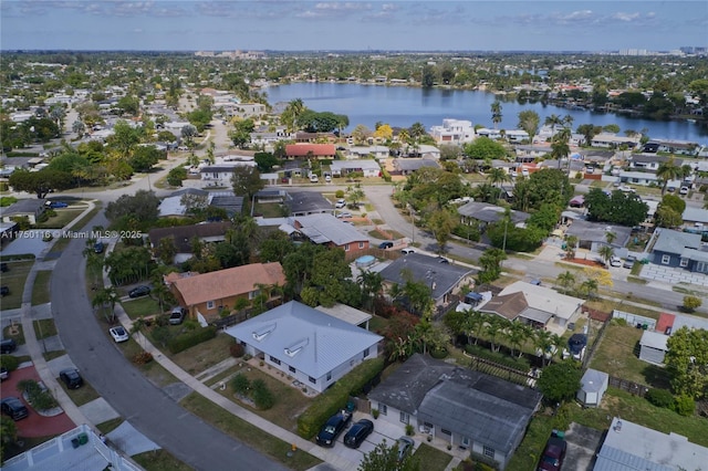 aerial view with a residential view and a water view