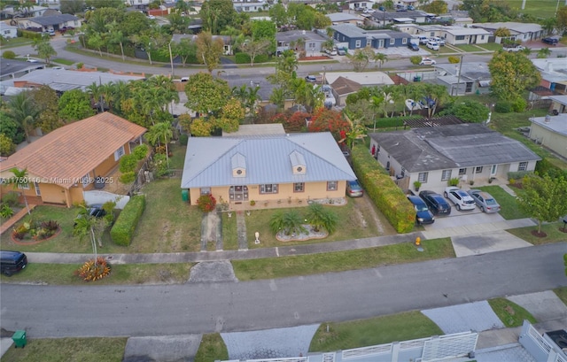 birds eye view of property with a residential view