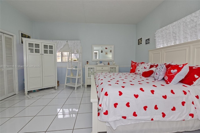 bedroom featuring light tile patterned flooring