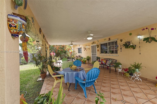 view of patio with ceiling fan and outdoor dining space