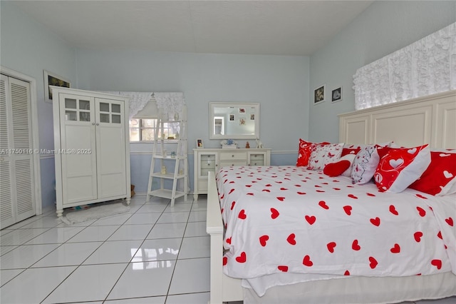 bedroom featuring light tile patterned floors