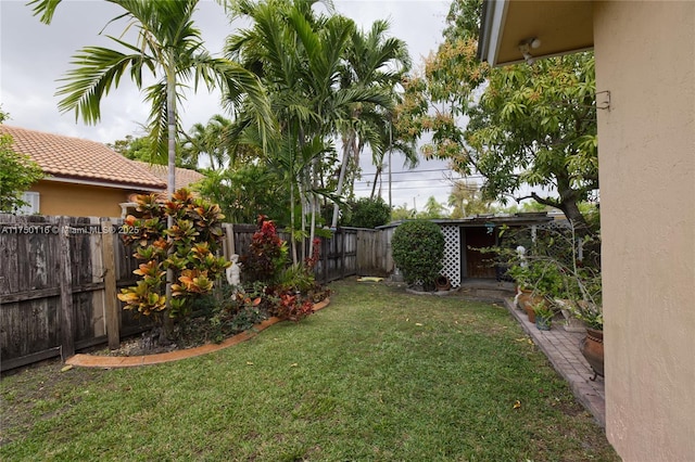 view of yard with a fenced backyard