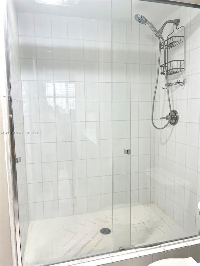 bathroom with a shower stall