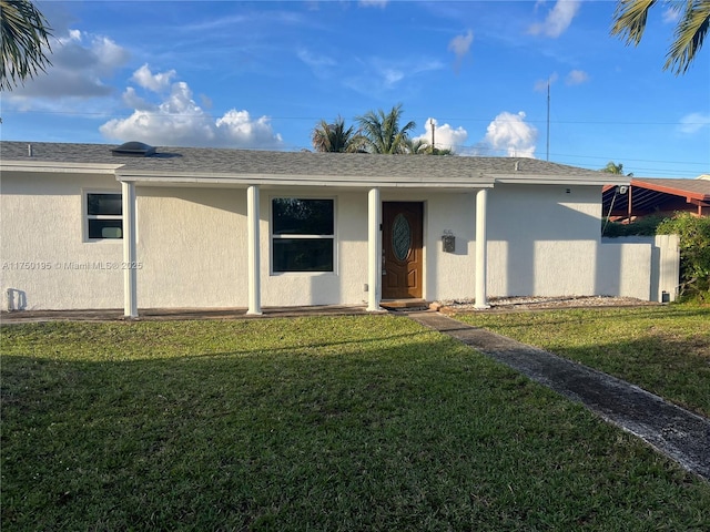 55 NE 213th St, Miami Gardens, FL 33179 - view of front facade with a front lawn and stucco siding