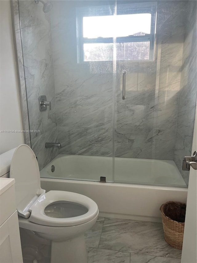 full bathroom with marble finish floor, combined bath / shower with glass door, vanity, and toilet