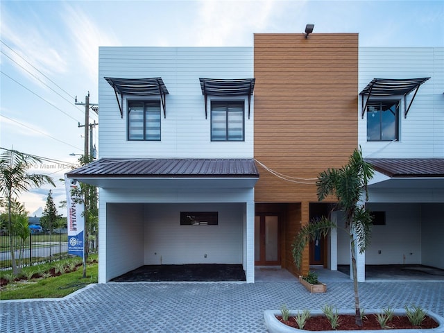 modern home featuring metal roof