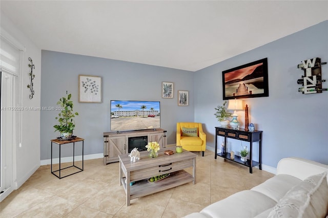 5300 Washington St Unit I203, Hollywood, FL 33021 - living room with light tile patterned floors and baseboards