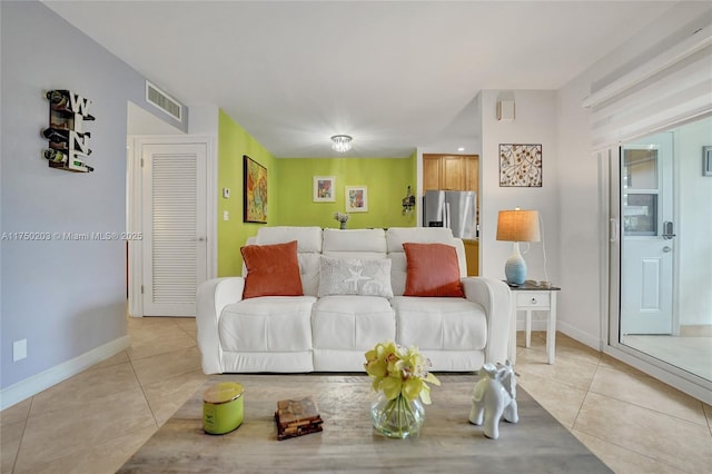 5300 Washington St Unit I203, Hollywood, FL 33021 - living room with light tile patterned floors, visible vents, and baseboards