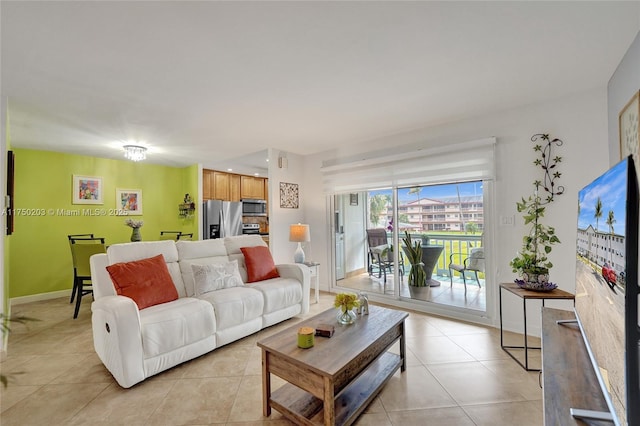 5300 Washington St Unit I203, Hollywood, FL 33021 - living room with baseboards and light tile patterned floors