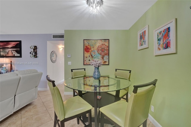 5300 Washington St Unit I203, Hollywood, FL 33021 - dining room with light tile patterned floors, visible vents, a chandelier, and baseboards