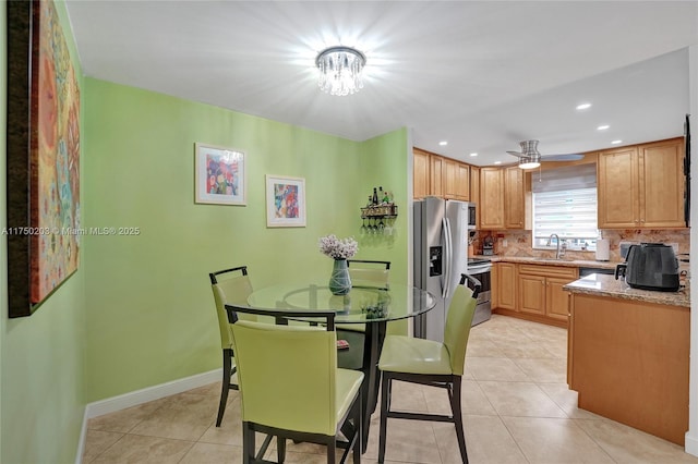 5300 Washington St Unit I203, Hollywood, FL 33021 - kitchen featuring light tile patterned floors, a sink, backsplash, and stainless steel appliances