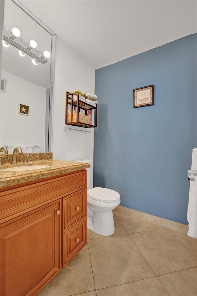5300 Washington St Unit I203, Hollywood, FL 33021 - bathroom with tile patterned floors, toilet, vanity, baseboards, and visible vents