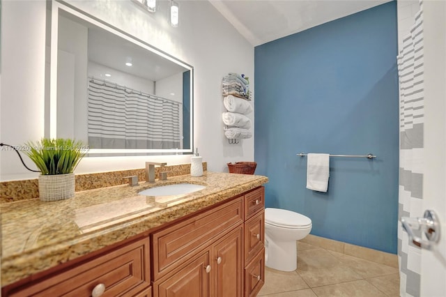 5300 Washington St Unit I203, Hollywood, FL 33021 - bathroom with vanity, tile patterned floors, toilet, vaulted ceiling, and baseboards