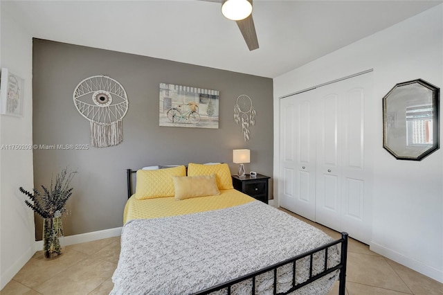 5300 Washington St Unit I203, Hollywood, FL 33021 - bedroom featuring baseboards, ceiling fan, light tile patterned flooring, and a closet