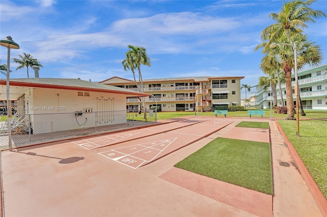 5300 Washington St Unit I203, Hollywood, FL 33021 - view of property's community with a yard, shuffleboard, and fence