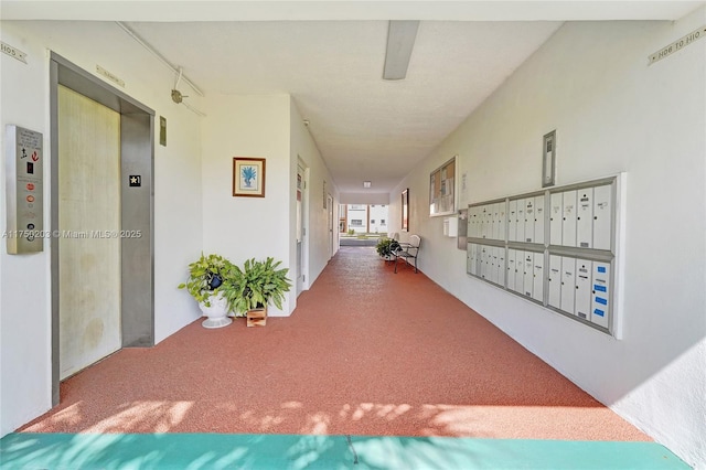 5300 Washington St Unit I203, Hollywood, FL 33021 - hall featuring elevator, carpet floors, and mail area