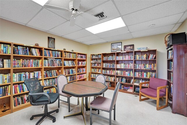5300 Washington St Unit I203, Hollywood, FL 33021 - living area featuring carpet, ceiling fan, bookshelves, visible vents, and a paneled ceiling