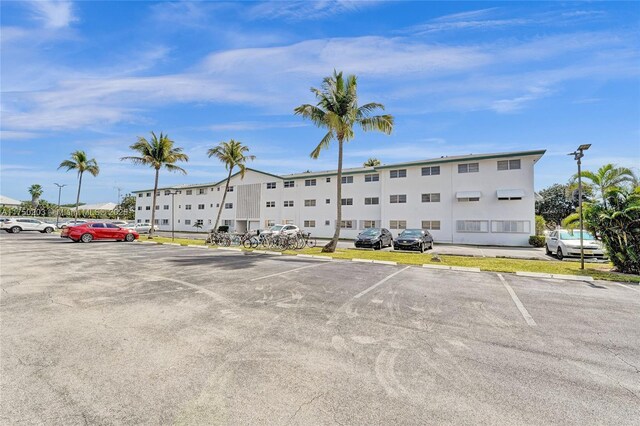 5300 Washington St Unit I203, Hollywood, FL 33021 - view of building exterior with uncovered parking