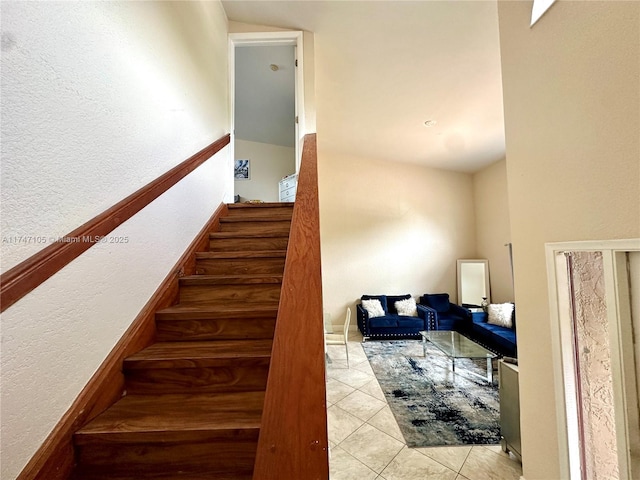 stairs featuring tile patterned flooring