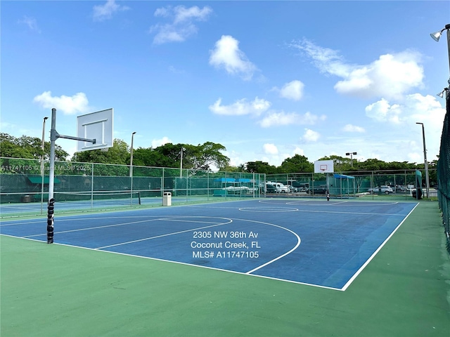 view of sport court featuring community basketball court and fence