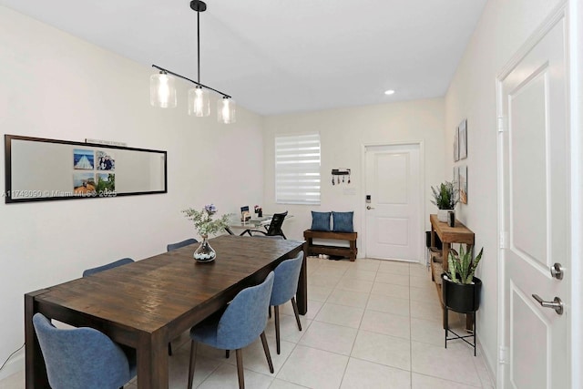 dining area with light tile patterned floors and recessed lighting